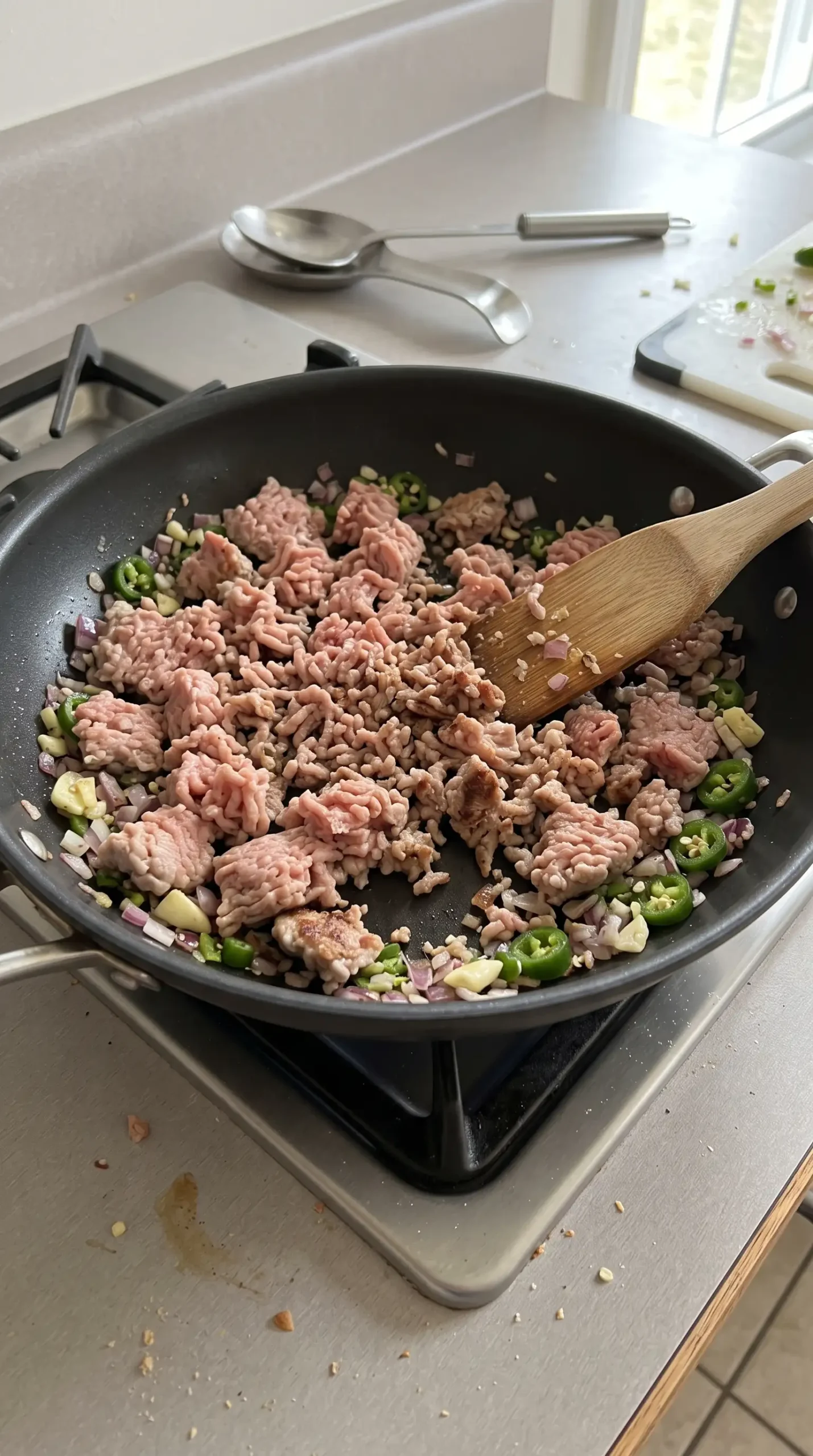 Ground turkey browning with onion, garlic, and jalapeños for turkey chili