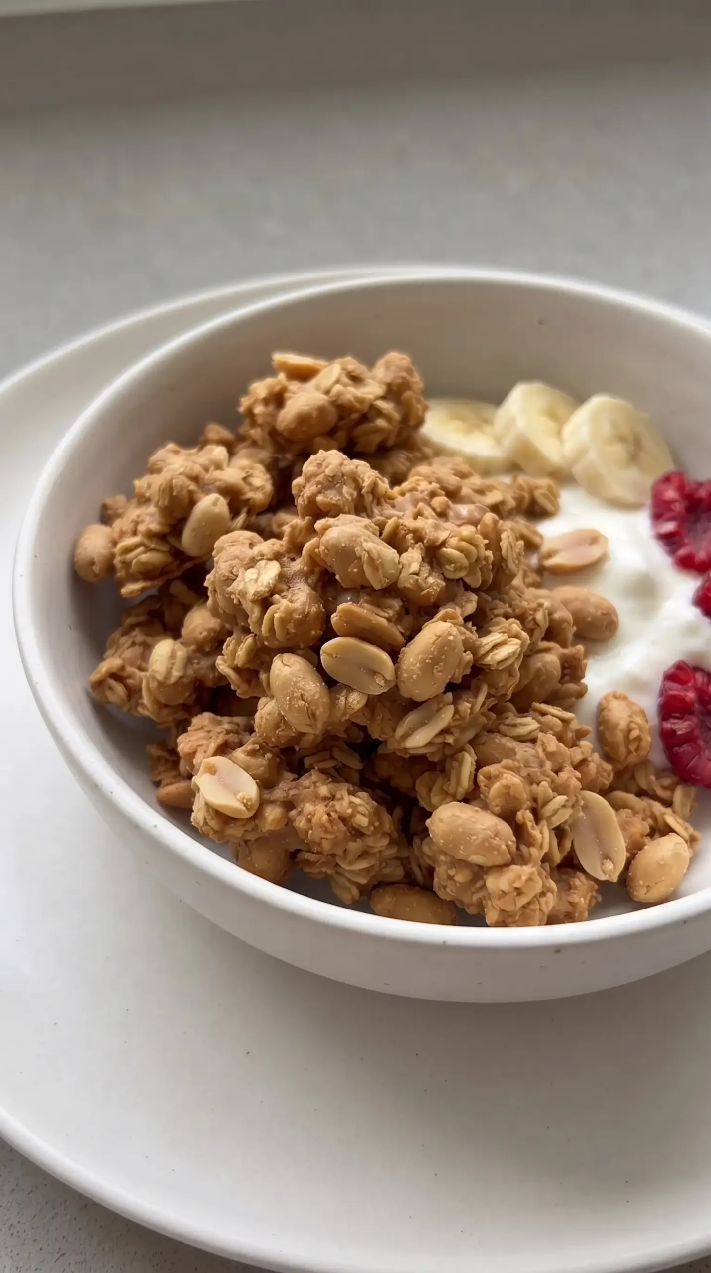 Peanut butter granola clusters served with yogurt and fresh fruit