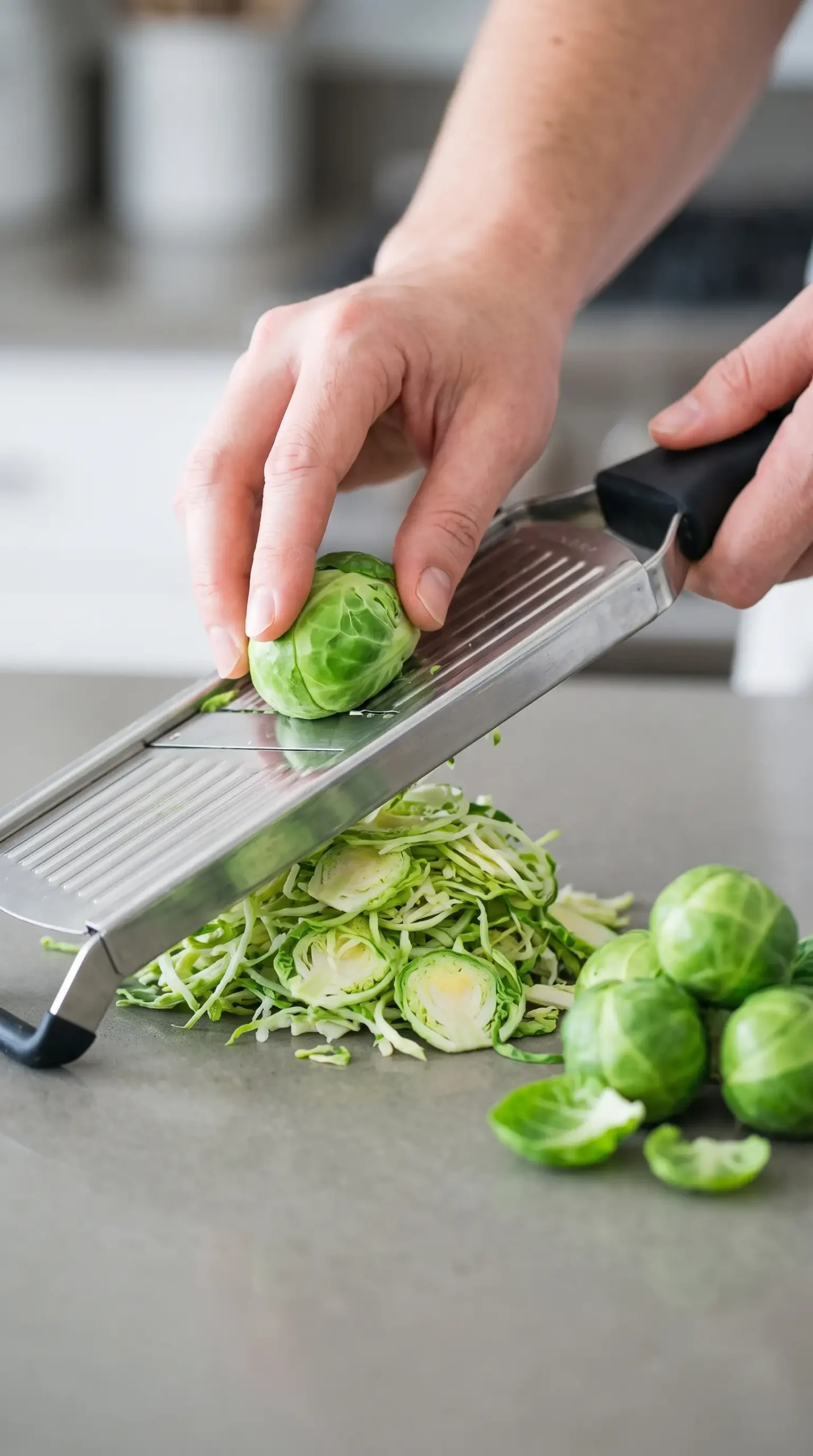Thinly shaved Brussels sprouts prepared for a fresh salad